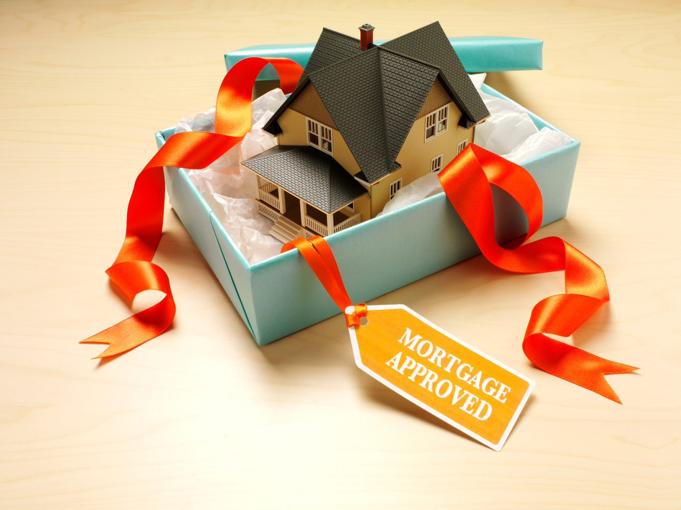 Mortgage Approved Label on a Unwrapped House Gift
